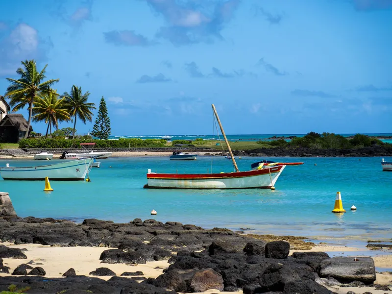 Fishing boats moored in a turquoise bay in Mauritius
