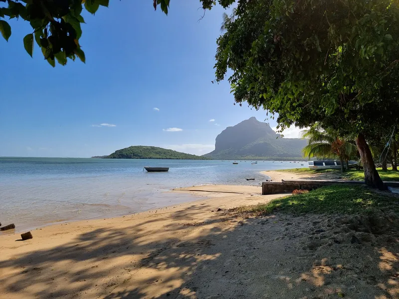 Sandy beach with Le Morne Brabant across the lagoon